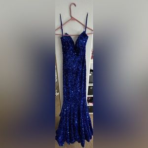 Im selling this prom dress from lady black tie!It’s a size 0 and darkroyal blue.